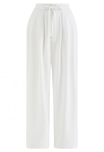 Calças largas de cintura com cordão com detalhe plissado em branco