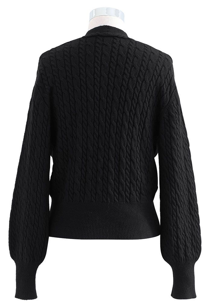 Suéter de corte frontal de malha de cabo em preto
