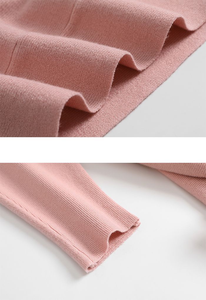 Suéter oversize de manga morcego com laço em rosa