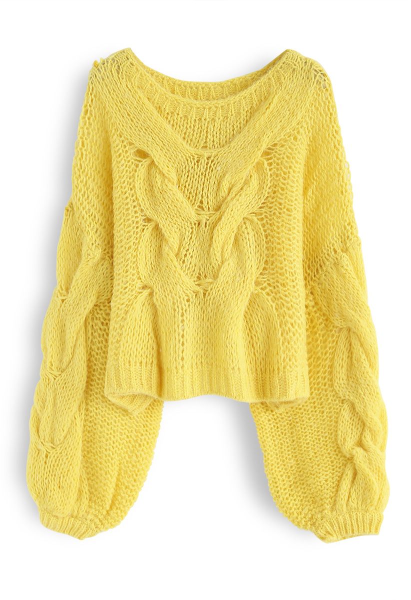 Suéter de mangas bufantes tricotado à mão em amarelo