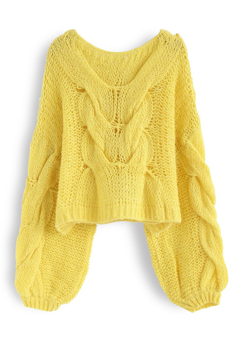 Suéter de mangas bufantes tricotado à mão em amarelo