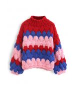 Suéter de gola alta tricotada à mão em cor bloqueada em vermelho
